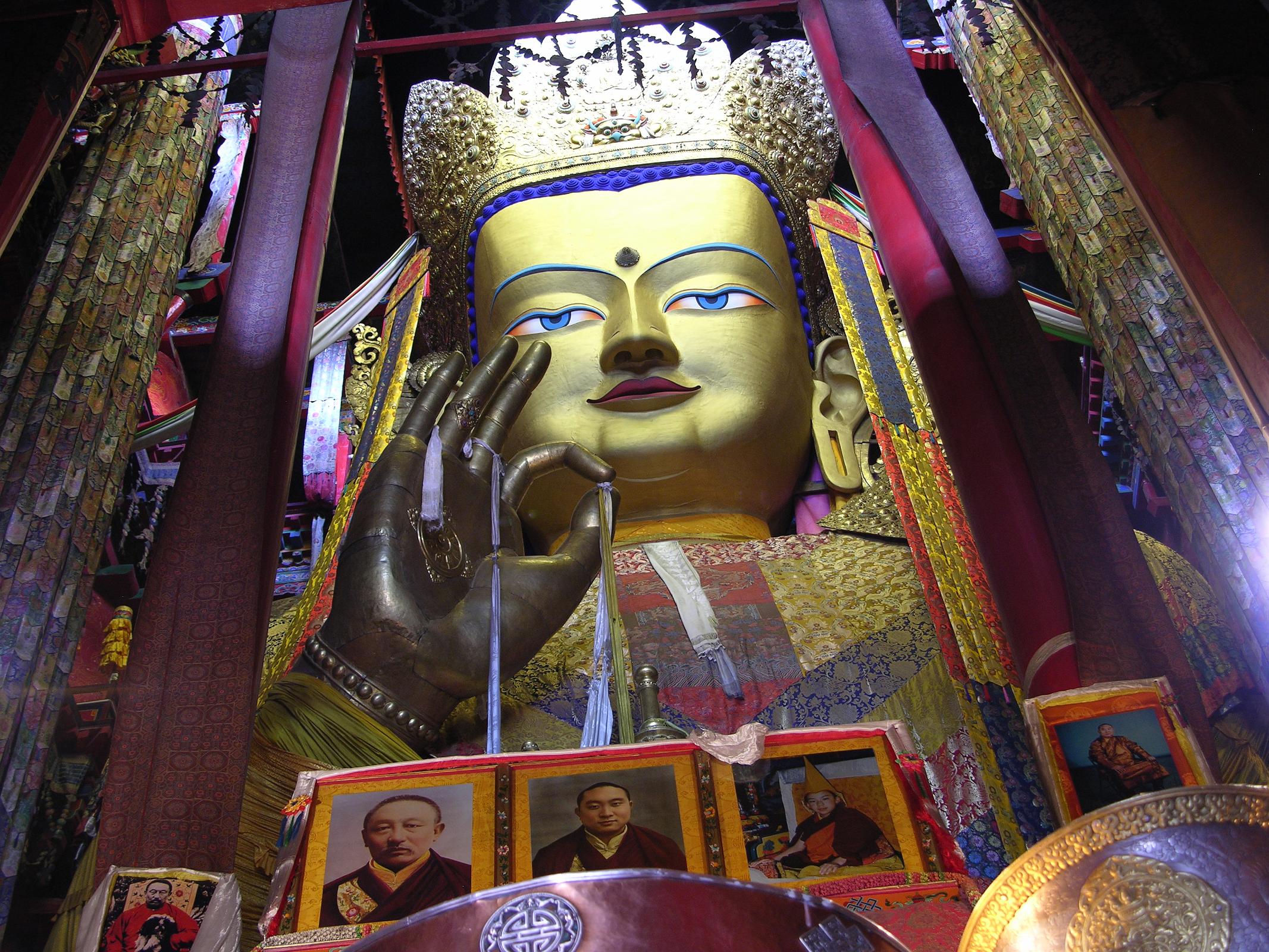 Tibet 07 02 Shigatse Tashilhunpo 26.2m Maitreya The most impressive Tashilhunpo sight is the Maitreya Chapel, a tall red building with a gold roof at the complexs northwestern corner, built in 1914 by the ninth Panchen Lama. It houses a 26.2m image of Maitreya, the Future Buddha, whose ears are 2.6m long and each finger 1.2m. The statue contains 279kg of gold and 150,000kg of copper and brass molded on a wooden frame.